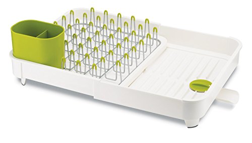 Escurreplatos Joseph Joseph de plástico blanco y verde anís, con sistema de drenaje de agua de enjuague, bellamente organizado para el secado óptimo de sus platos.